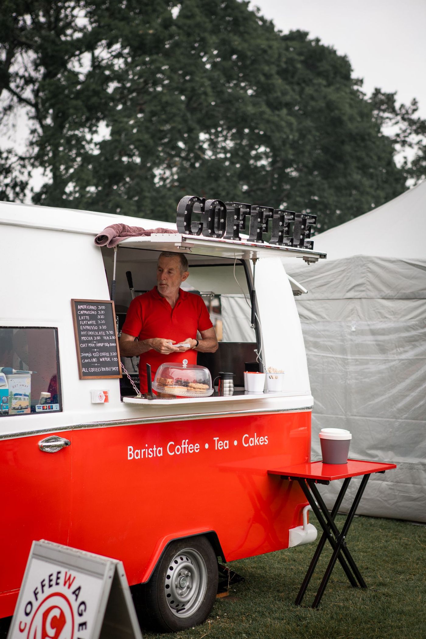 A coffee van serving customers at an outdoor event