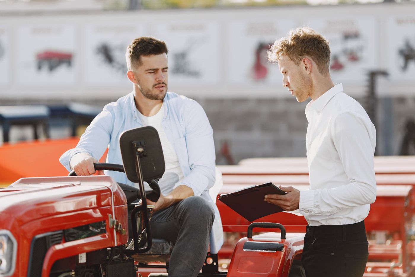 A salesperson talking a visitor through a product at a trade show