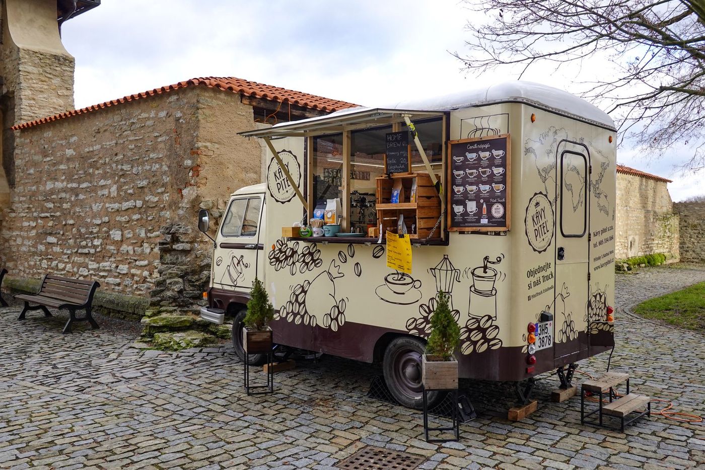 A mobile coffee and food van trading in a town square