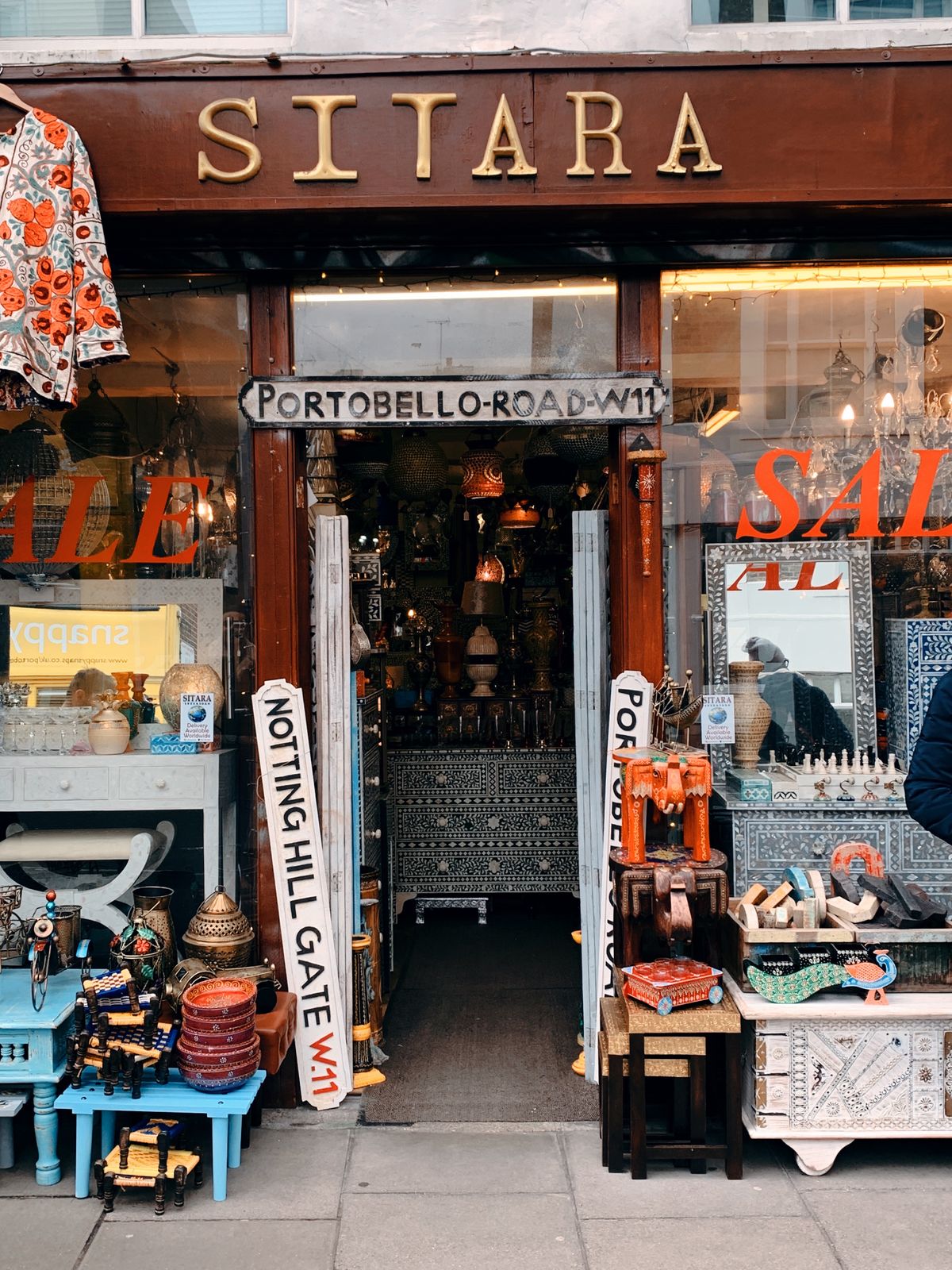 An independent shop with painted fascia lettering and a window display